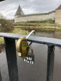 Close-up of padlock on railing