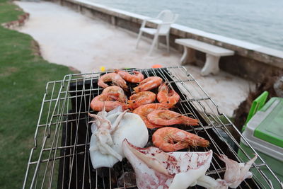 High angle view of fish on barbecue grill