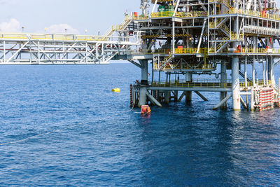A fast rescue craft being deployed next to an oil production platfoem at oil field