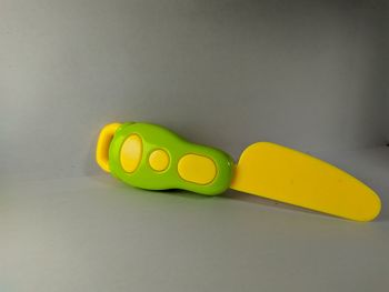 Close-up of green toy on table