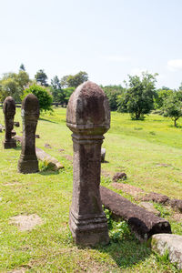 View of cemetery in field against sky