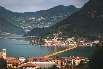 High angle view of river and buildings in city