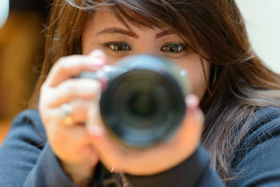 Portrait of woman photographing