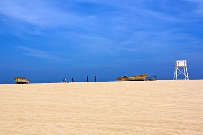 Scenic view of landscape against blue sky