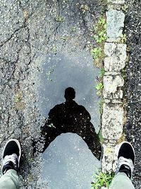 Midsection of man with umbrella