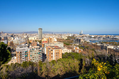 View of barcelona with the columbus statue from montjuic mountain