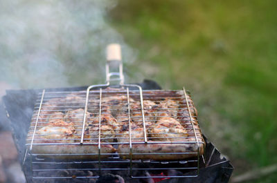 Close-up of meat on barbecue grill