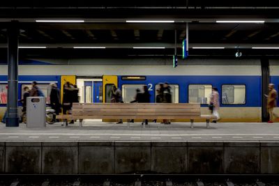 People walking on railroad station platform