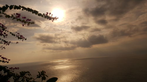 Scenic view of sea against cloudy sky