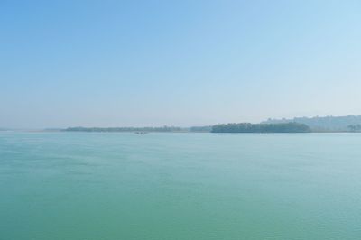 Scenic view of sea against clear blue sky