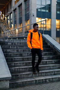 Full length of man walking on staircase