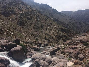 High angle view of river amidst mountains