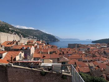 High angle view of townscape against blue sky