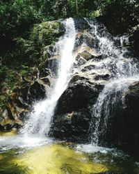 Close-up of waterfall against sky