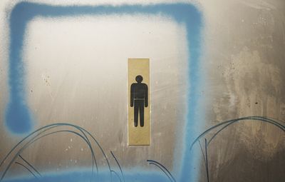 Male restroom sign on door