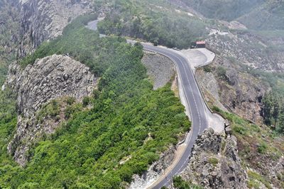 High angle view of road amidst mountains