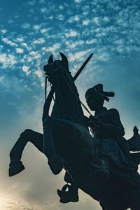 Low angle view of statue against sky