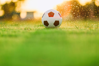 Close-up of soccer ball on field