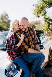 Young couple sitting in car