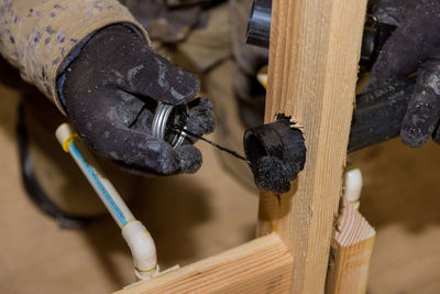High angle view of chain on wood