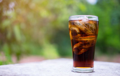 Close-up of iced tea on table