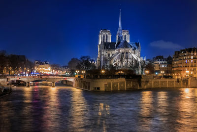 Illuminated buildings in city at night