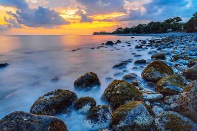 Scenic view of sea against sky during sunset