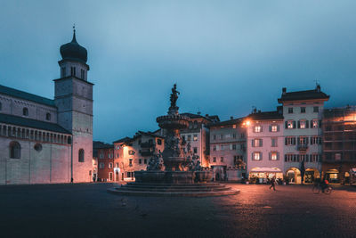 Buildings in city at dusk