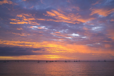 Scenic view of sea against orange sky