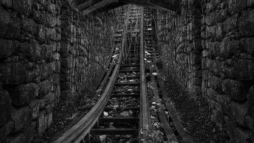 Railroad tracks by bridge