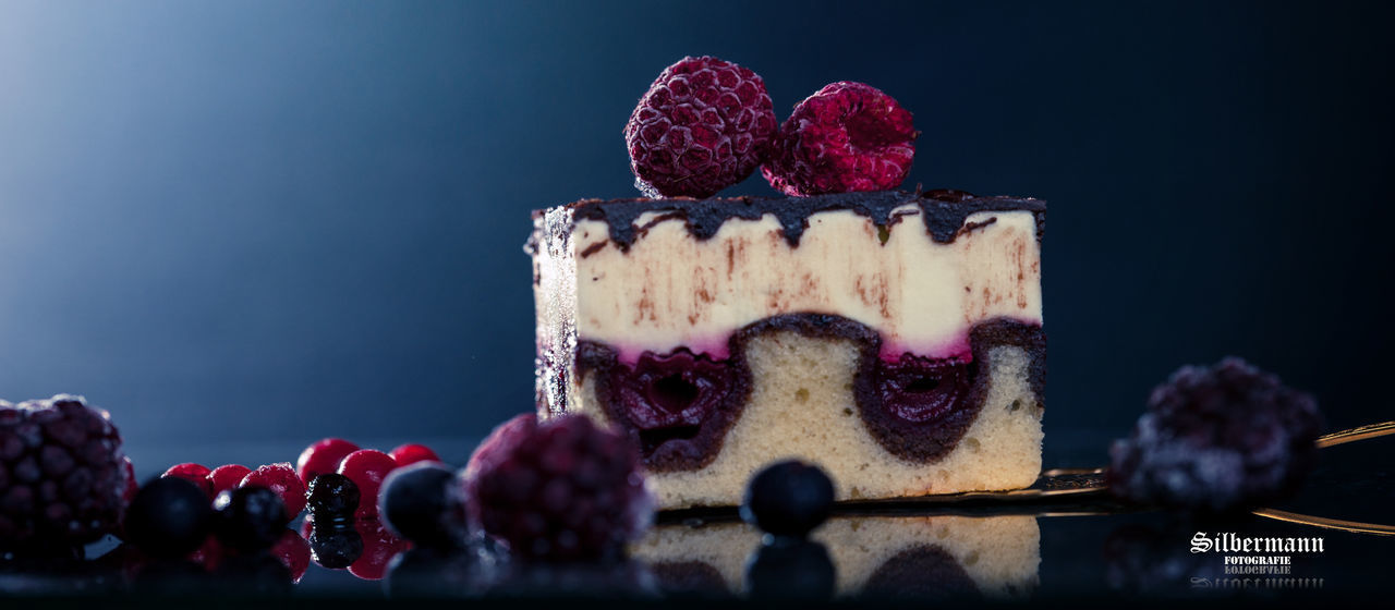 CLOSE-UP OF CAKE WITH STRAWBERRIES