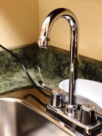 Close-up of faucet at home