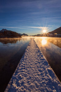 Scenic view of lake against sky during sunset