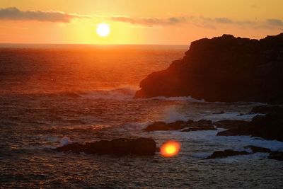 Sunset over dramatic coast. isles of scilly