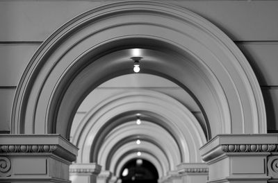 Light bulbs on arches of historic building