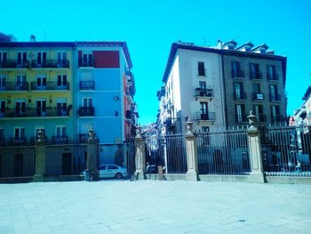 Buildings against blue sky and clouds