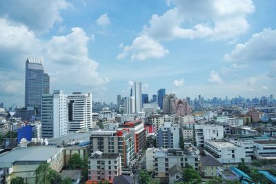 Buildings in city against sky