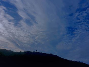 Low angle view of silhouette mountain against sky