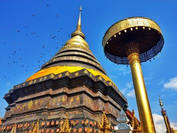 Low angle view of traditional building against blue sky