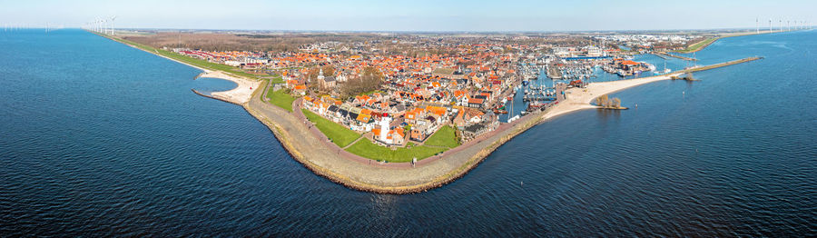 High angle view of city by sea