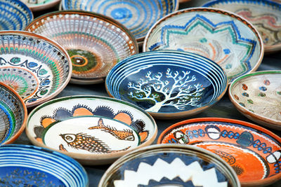 High angle view of romanian traditional ceramic plates for sale at market
