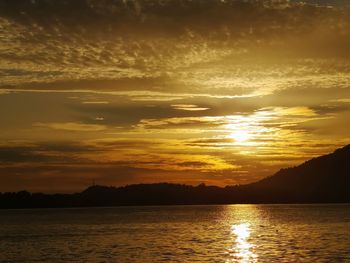 Scenic view of lake against sky during sunset