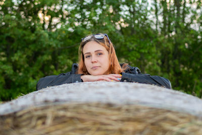 Portrait of young woman in forest