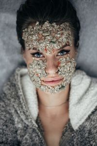 Close-up portrait of young woman wearing facial mask