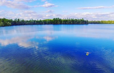 Man floating on lake