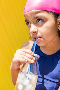 Close-up of woman drinking water