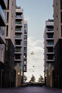 Street amidst buildings in city against sky