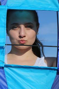 Portrait of young woman with kite