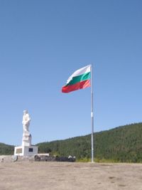 Low angle view of statue against clear blue sky