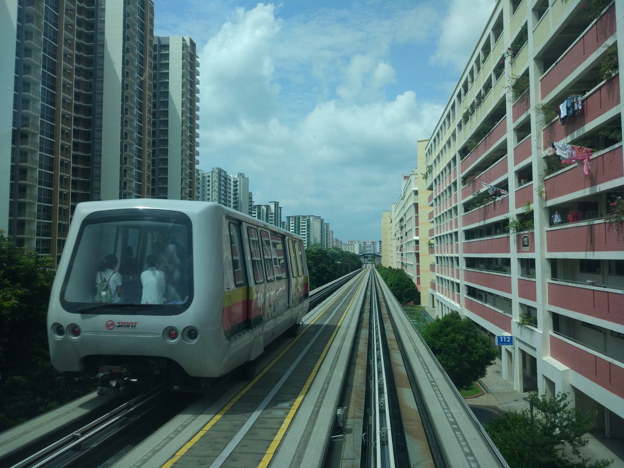 TRAIN ON RAILROAD TRACKS AGAINST SKY